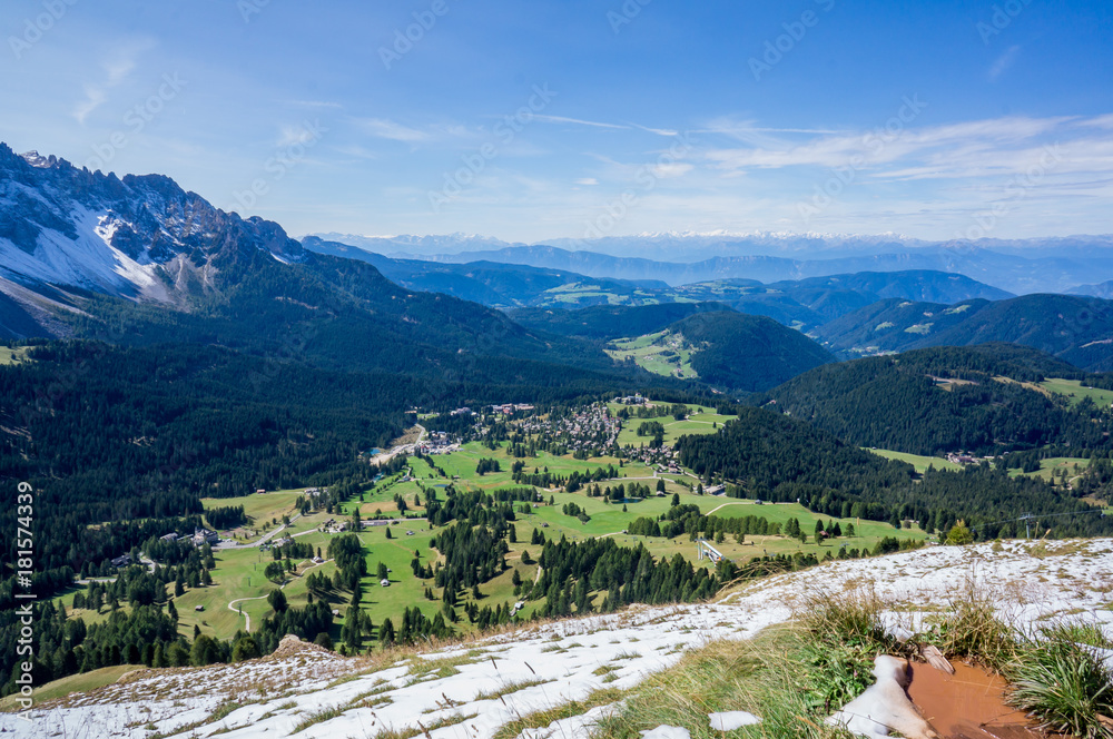 Snow mountains and green valley at summer sunny day. Dolomites Alps, Rosengarden Group, South Tirol, Italy.