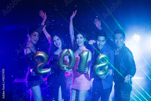 Night club and DJ party with friends in new year party, dancing and celebrating concept