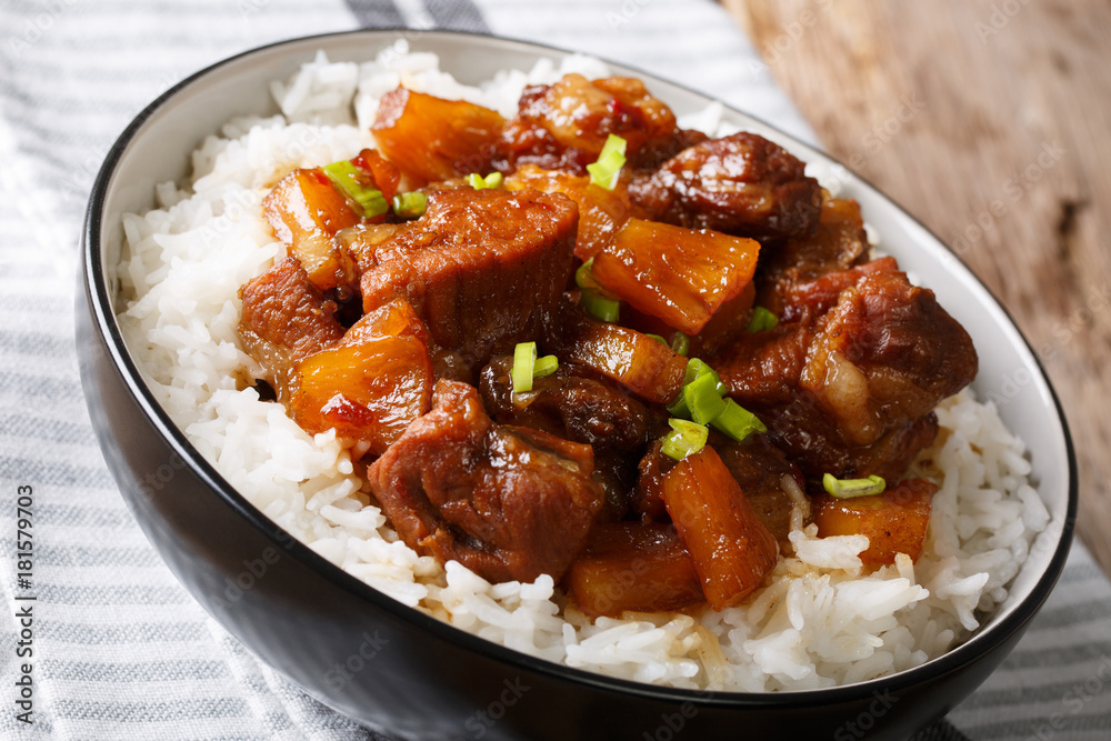 Filipino belly pork hamonado with pineapple and rice close-up. horizontal Filipino belly pork hamonado with pineapple and rice close-up. horizontal