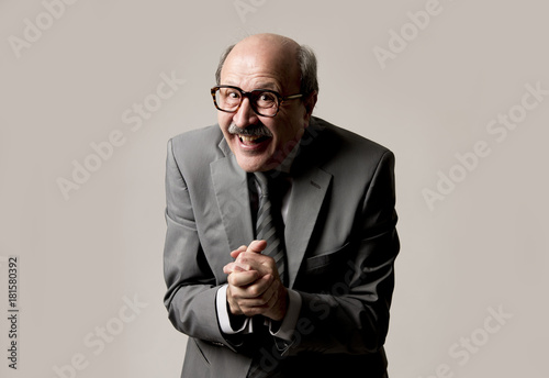portrait of happy and excited senior mature business man on his 60s gesturing spastic and satisfied in business success and fun photo