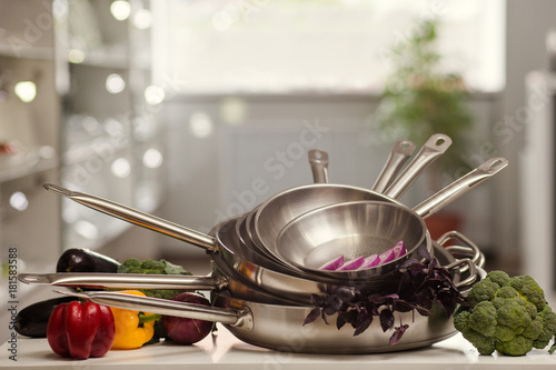 stack of cooking and frying pans with free space above. Kitchen utensils shop advertisement concept
