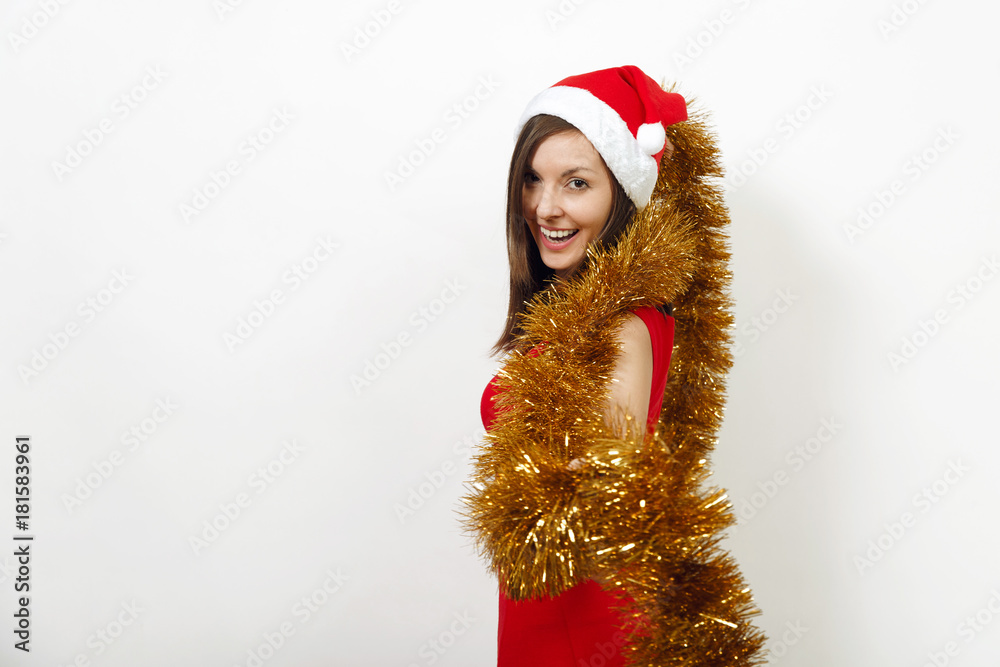 Beautiful caucasian young happy woman with healthy skin and charming smile in red dress, Christmas hat and garland of tinsel on white background. Santa girl isolated. New Year holiday 2018 concept Beautiful caucasian young happy woman with healthy skin and charming smile in red dress, Christmas hat and garland of tinsel on white background. Santa girl isolated. New Year holiday 2018 concept