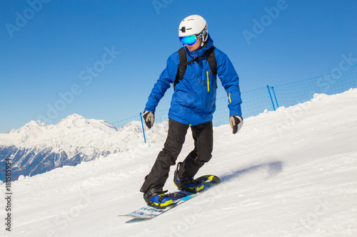 snowboarder skating in ski resort