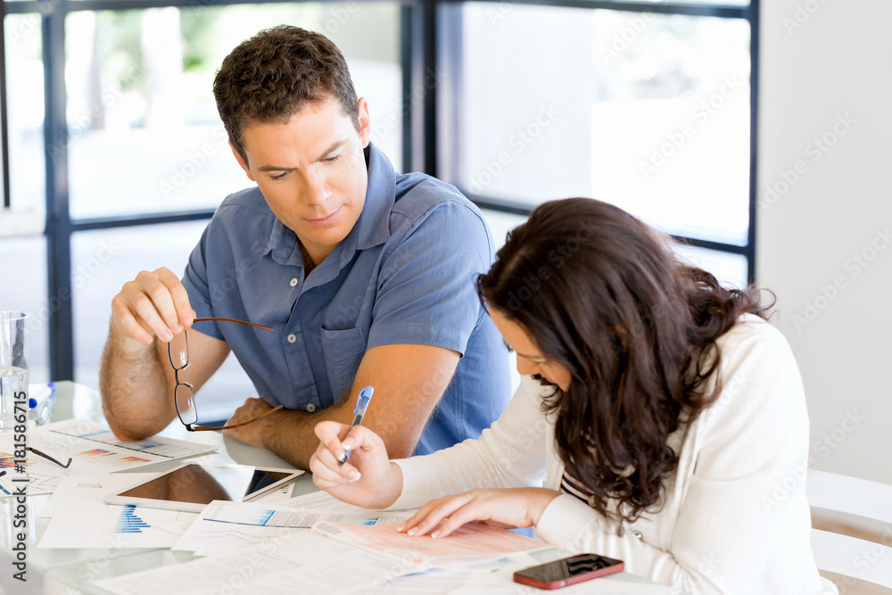 Image of two young business people in office Image of two young business people in office