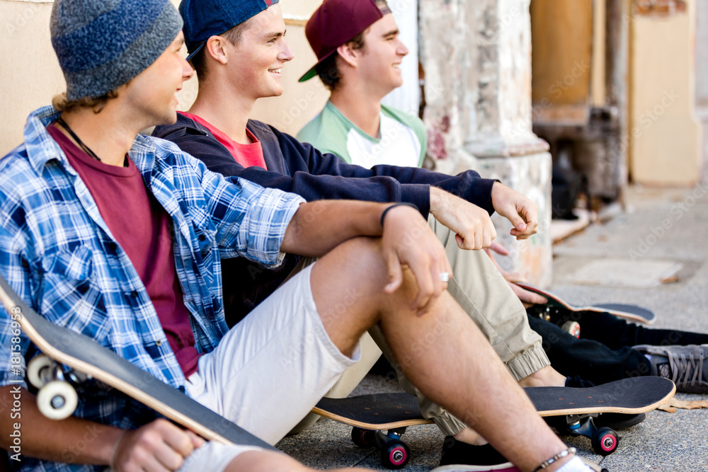 Skaters having a break at the street Skaters having a break at the street