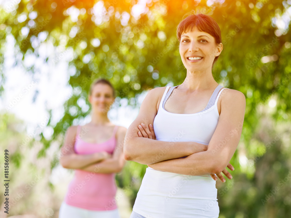 Fototapeta premium Young women exercising in the park