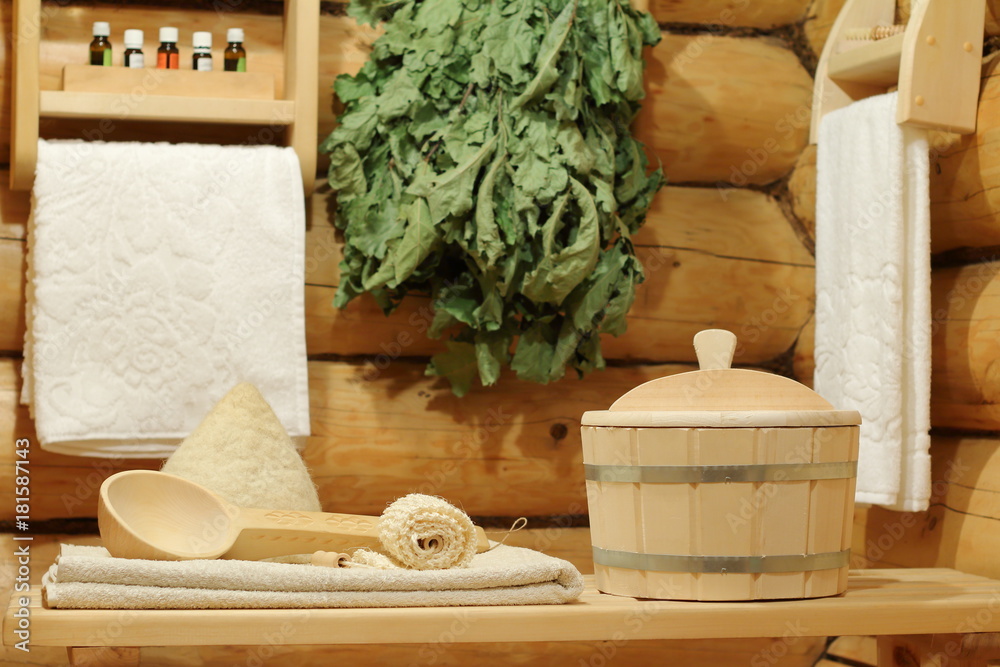 Interior of sauna and bath accessories. Bath accessories in the log corner of the room of the Russian bath. Interior of sauna and bath accessories. Bath accessories in the log corner of the room of the Russian bath.