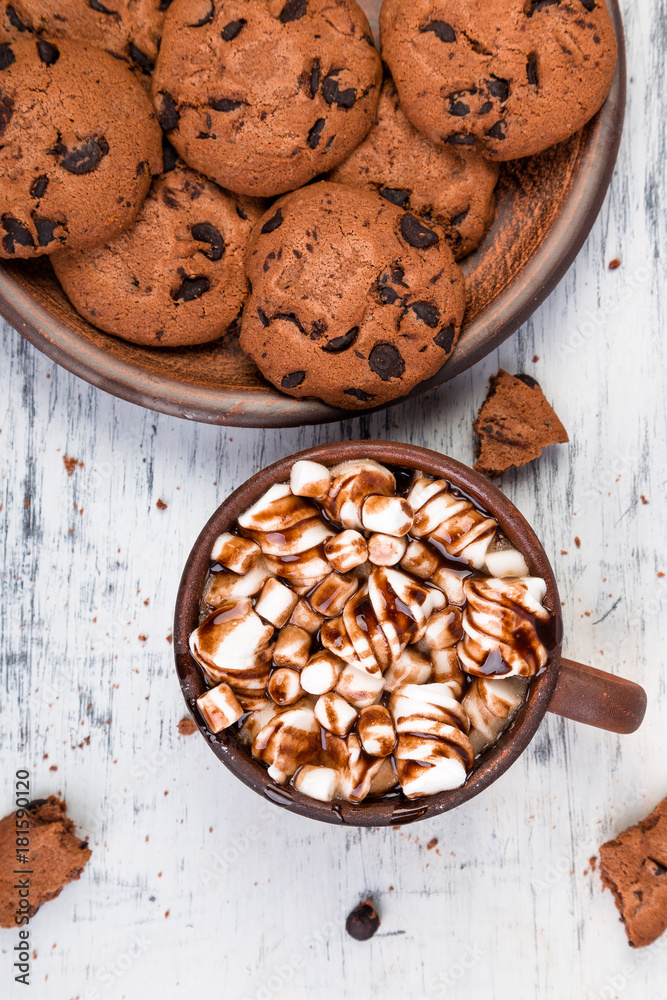 Hot chocolate with marshmallow and chocolate cookies. Flat lay. Hot chocolate with marshmallow and chocolate cookies. Flat lay.