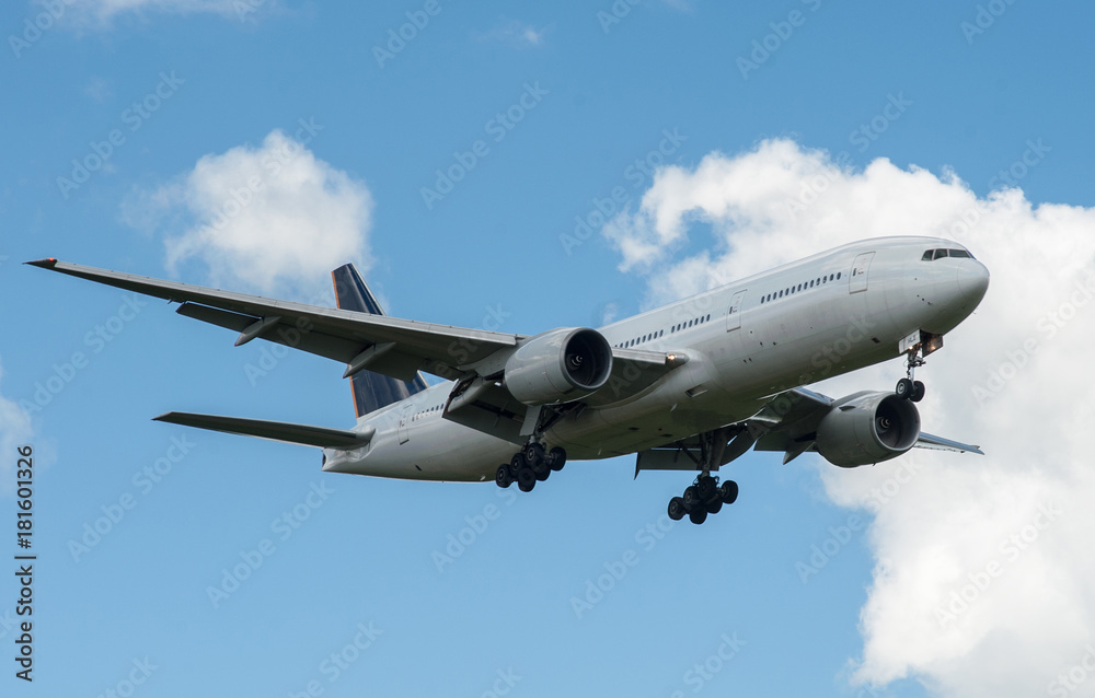 The plane on a background of blue sky and white clouds. The plane on a background of blue sky and white clouds.