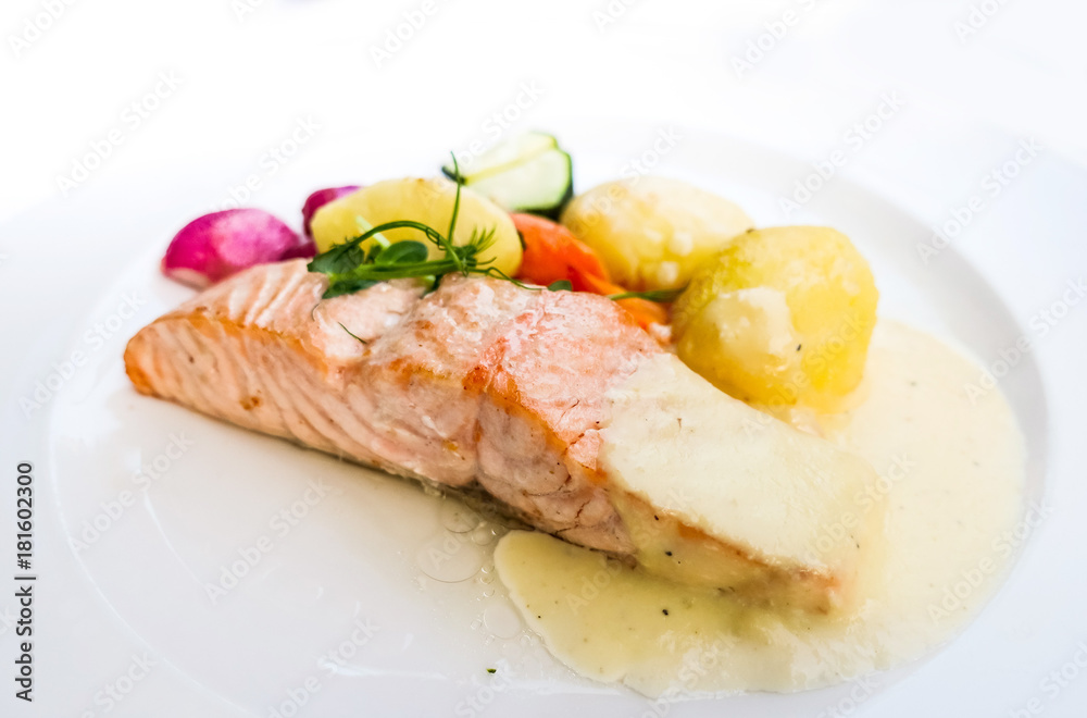 Grilled Salmon with fresh lettuce and mash potatoes Grilled Salmon with fresh lettuce and mash potatoes