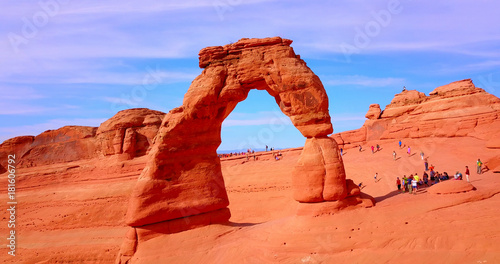 Red Stone Arch With Tourists Around An Overlook - Arches National Park, Utah