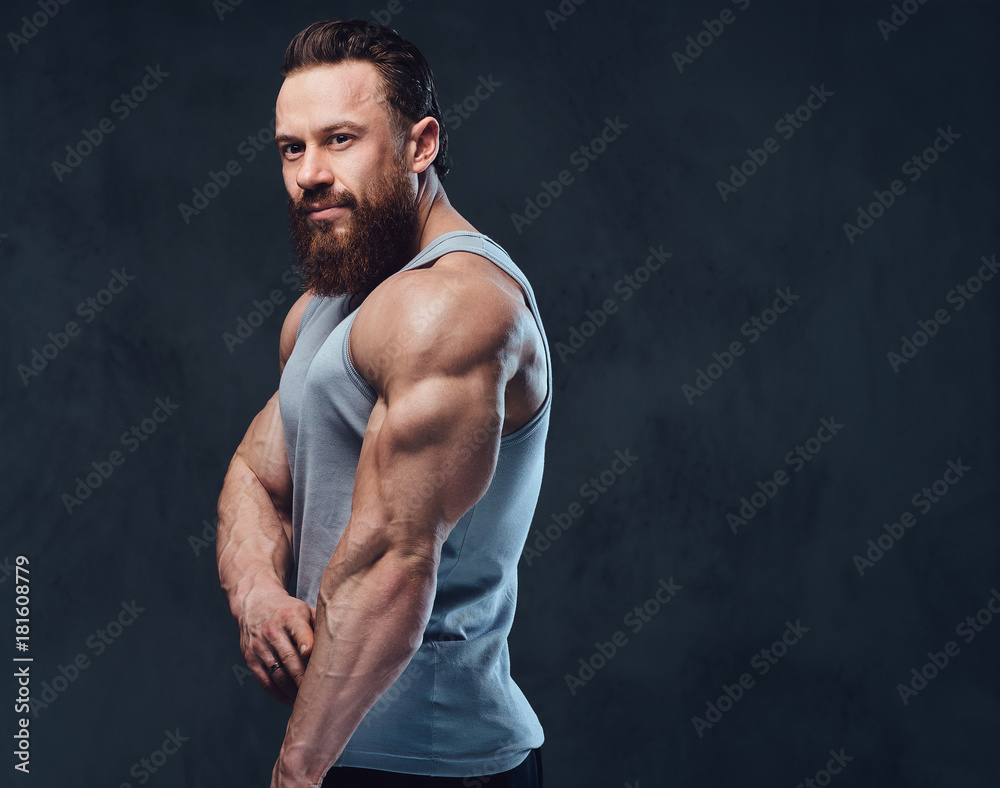 Bearded bodybuilder dressed in a tank top. Bearded bodybuilder dressed in a tank top.