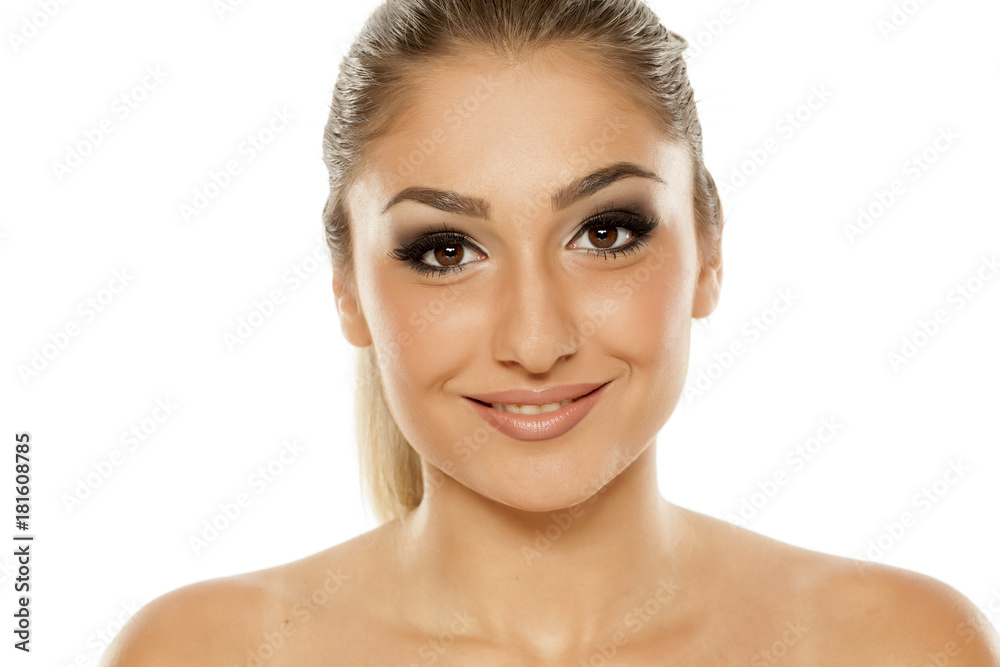 Portrait of beautiful young woman with makeup on white background Portrait of beautiful young woman with makeup on white background