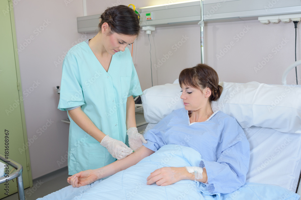 Fototapeta premium nurse taking another blood from the patient