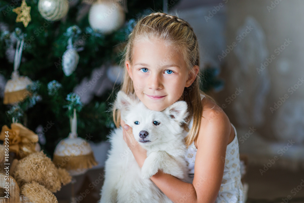Happy girl near Xmas tree Happy girl near Xmas tree