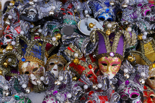 Colorful carnival masks on the market in Venice, Italy. Masks were worn in Venice to disguise the wearer from illicit activities:gambling, dancing, affairs or even political assignation.