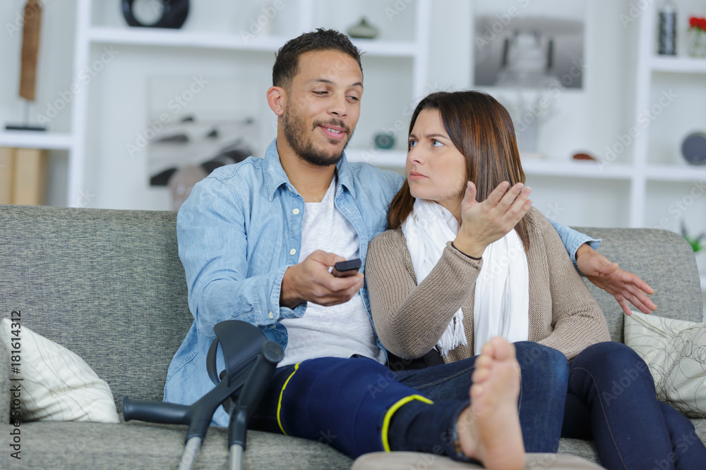 injured boyfriend watching tv with girlfriend injured boyfriend watching tv with girlfriend