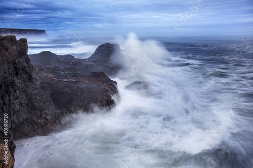 Heavy surf at Dyrh  laey on the south coast of Iceland