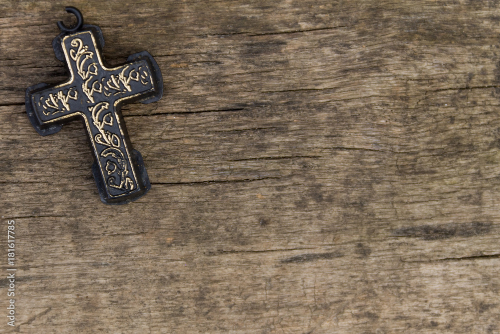 Christian Cross on old wooden table. Religion concept. Top view