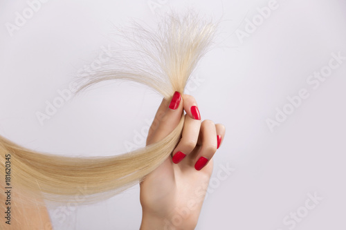 Close up of a bunch of hair in ones hand