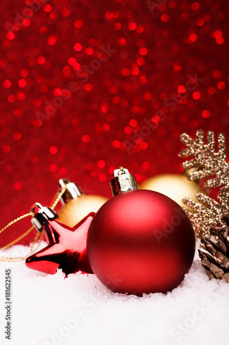 Christmas composition of Christmas tree toys on a red background