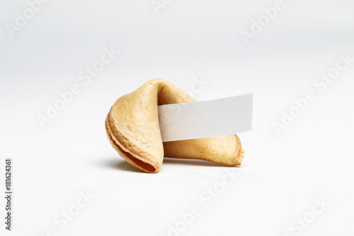 Picture of one Chinese cookie with wish on empty background.