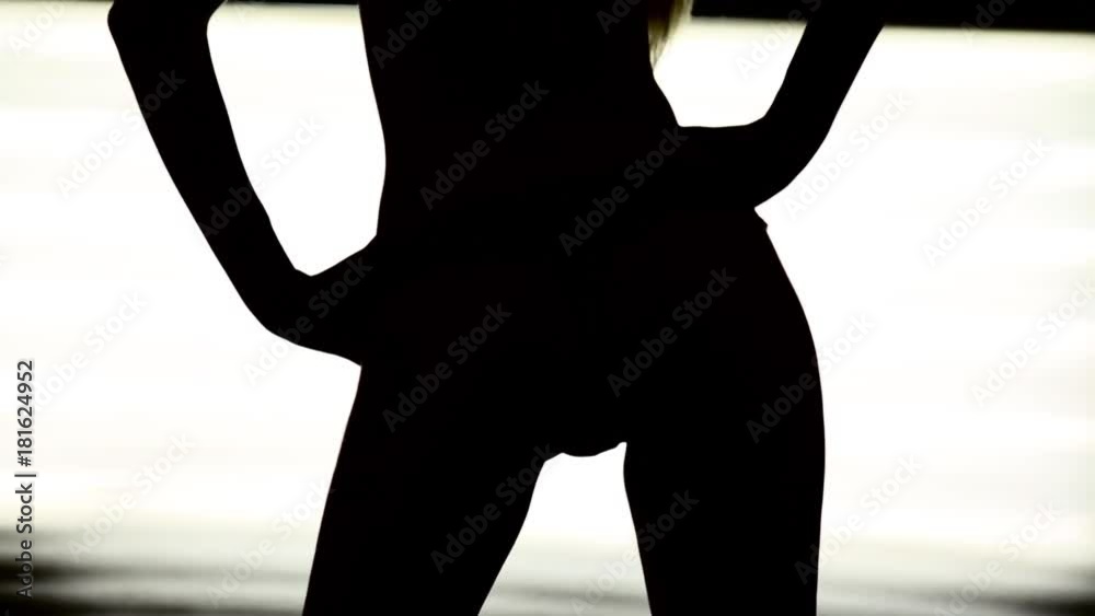 Dancing Silhouette of womans ass on a white background