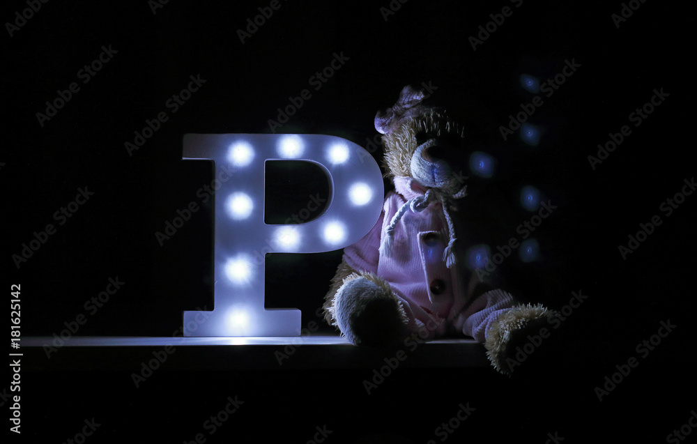 Letter P with dark light in room - obrazy, fototapety, plakaty 