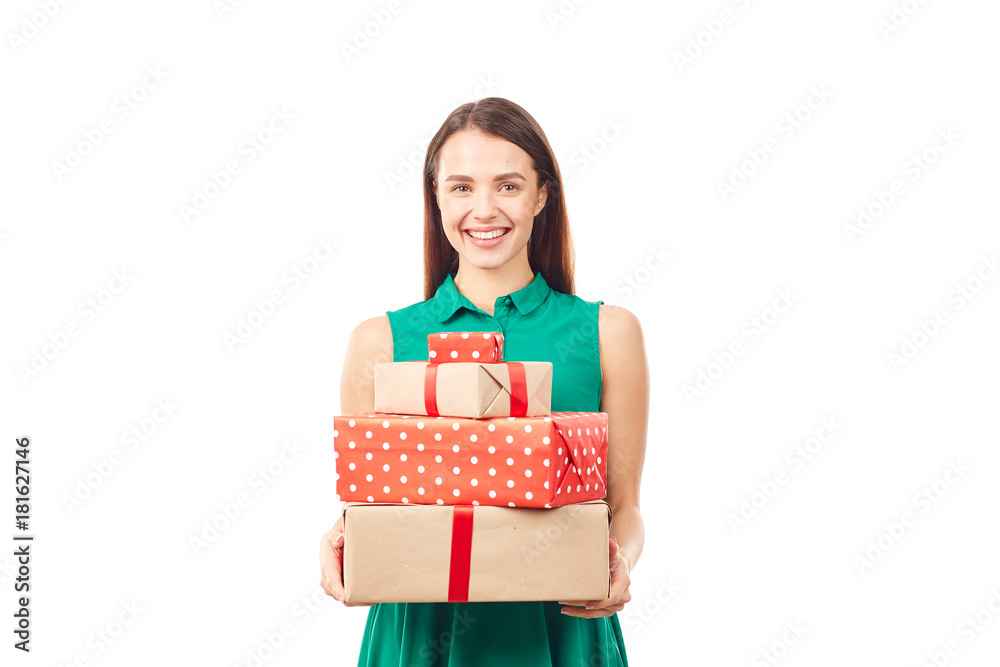 Portrait of young woman posing with heap of gift boxes on white background Portrait of young woman posing with heap of gift boxes on white background
