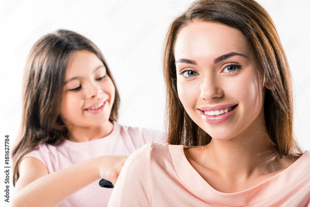 Daughter combing mothers hair Daughter combing mothers hair