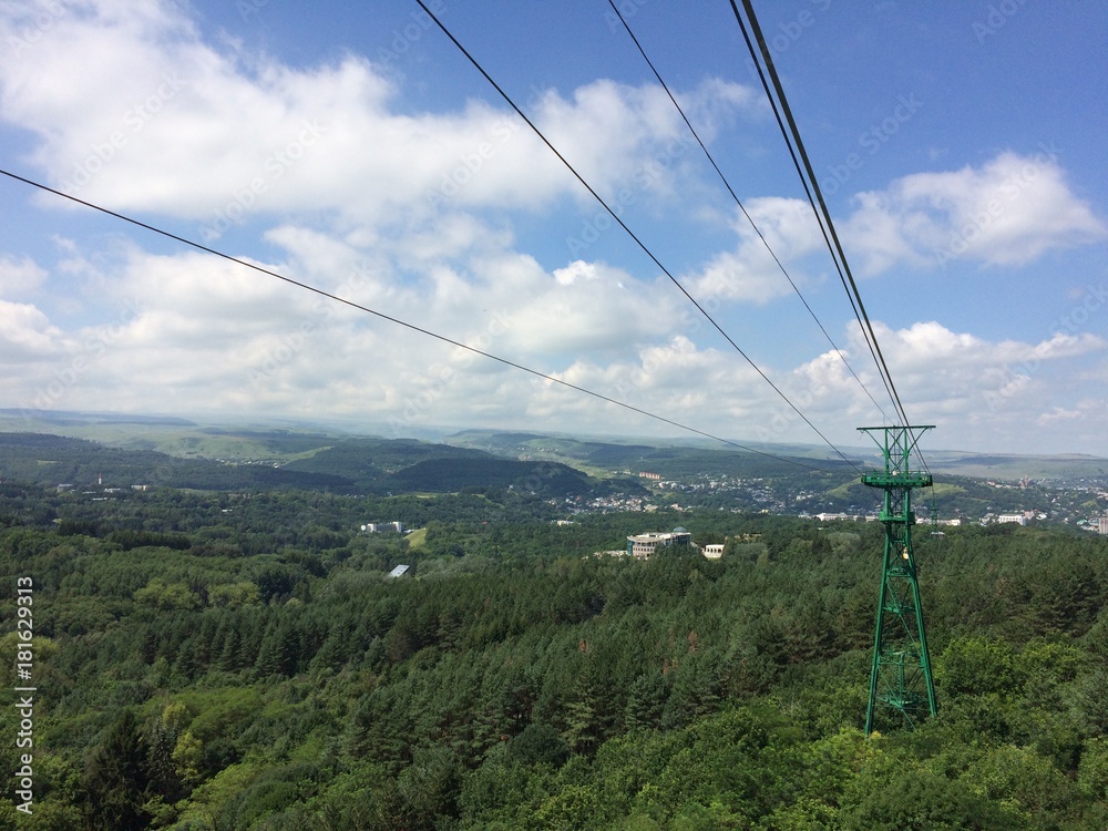 the mountains. North Caucasus. cableway. tower. green Forest. blue sky. clouds. nature. journey. the mountains. North Caucasus. cableway. tower. green Forest. blue sky. clouds. nature. journey.