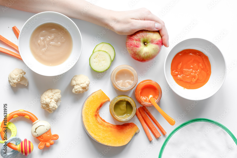 cooking vegetable puree for baby on white background top view cooking vegetable puree for baby on white background top view