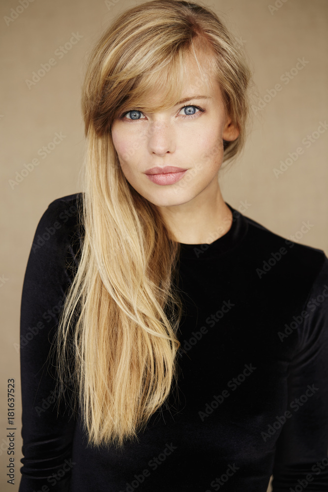 Naklejka premium Portrait of beautiful blond woman in black