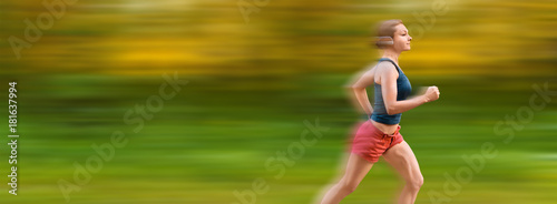 Young sport woman runs very fast. Motion blur on background.