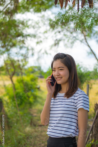 Portrait of asian girl talking on telephone