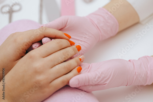 Manicurist does manicure