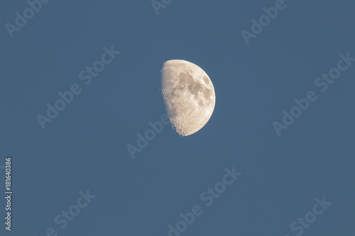 Close up of Gibbous Moon during the day with details of craters and the moon's surface