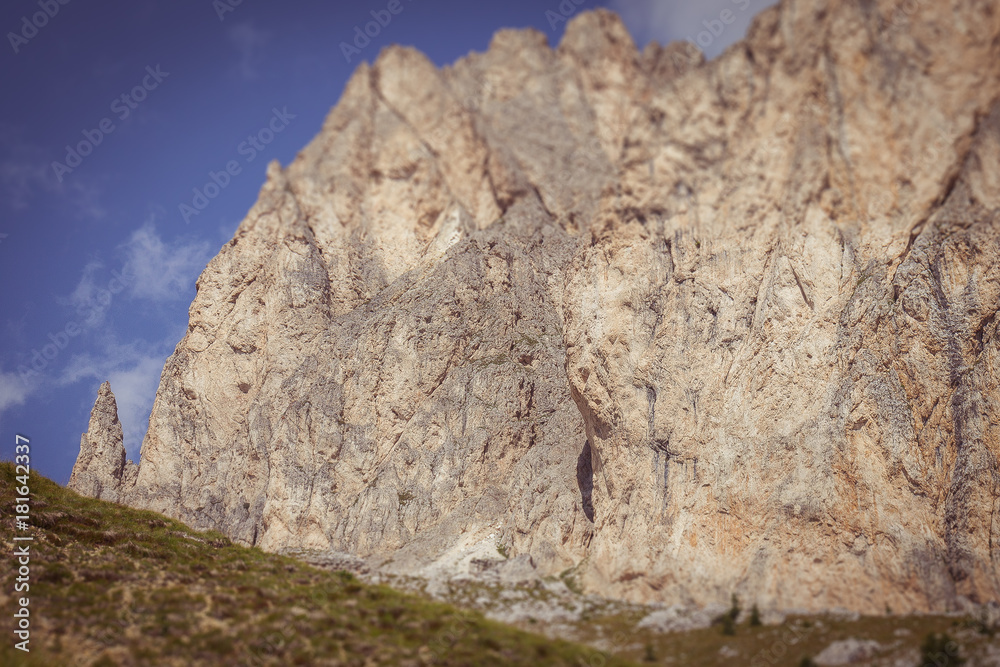 Vertical dolomitic pinnacles and crest of Mount Settsass tilt shift effect, Valparola Pass, Dolomites, Italy