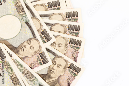 Japanese currency yen bank notes. The yen is the official currency of Japan. It is the third most traded currency in the foreign exchange market after the United States dollar and the euro photo