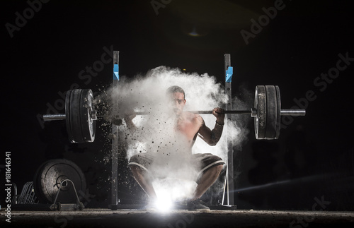 Man Holding a Weight in the Gym