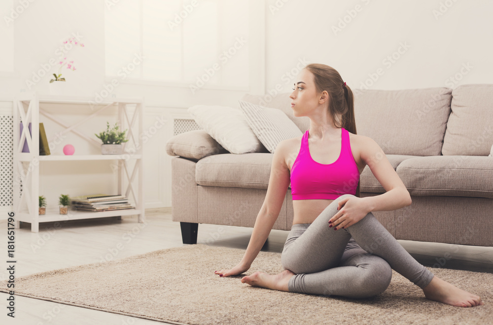 Woman training yoga in twisting sage pose. Woman training yoga in twisting sage pose.