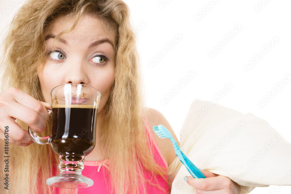 Happy woman holding toothbrush and coffee Happy woman holding toothbrush and coffee
