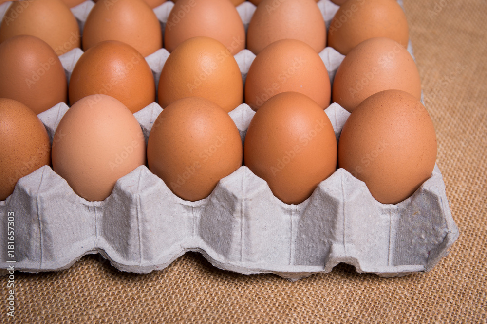 Fresh organic panel eggs on sackcloth Fresh organic panel eggs on sackcloth