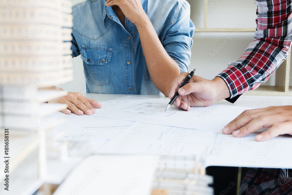 engineer colleagues working on blueprint, interior architect concept