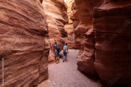 Couple of tourists exploring Red Canyon near Eilat, Israel photo