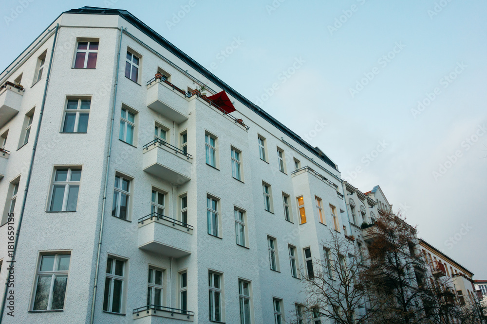 low angle view of white apartment house in the evening