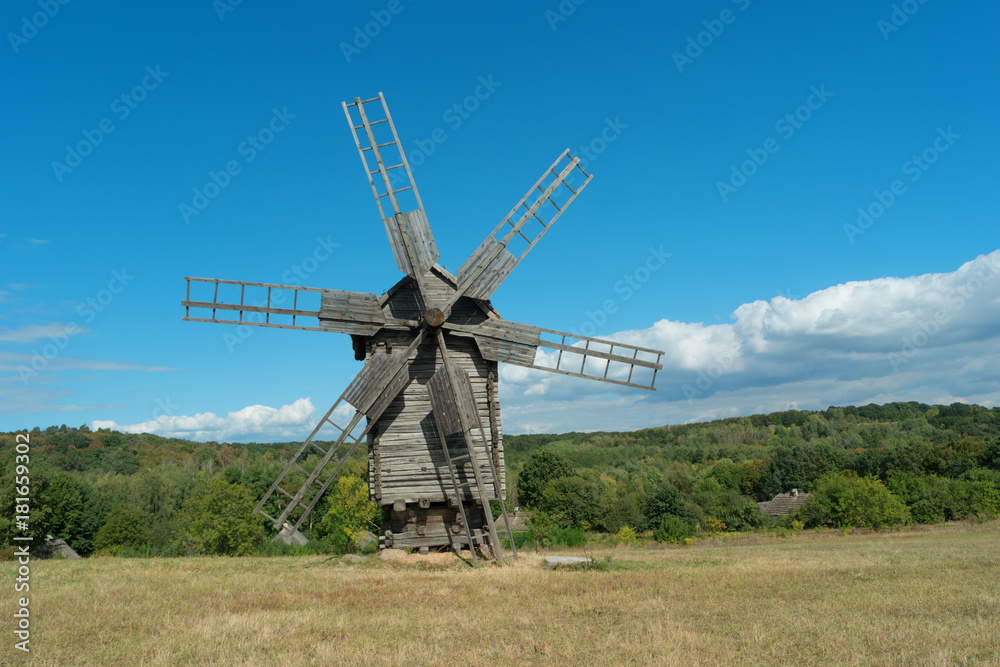 Old fashioned wooden wind mill.