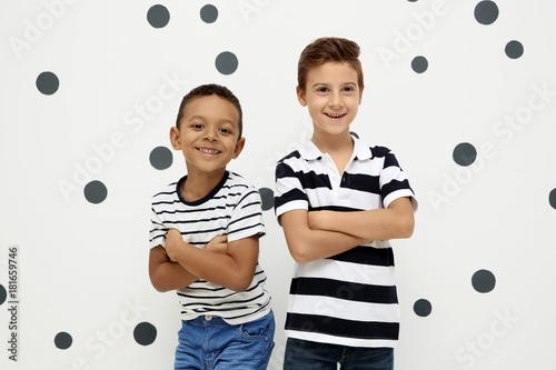 Cute stylish boys on light ...