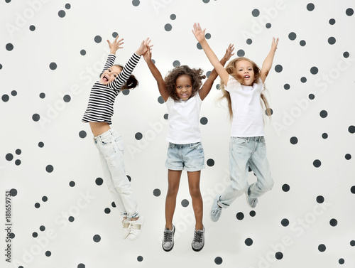 Cute stylish girls jumping ...