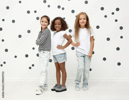 Cute stylish girls near lig...